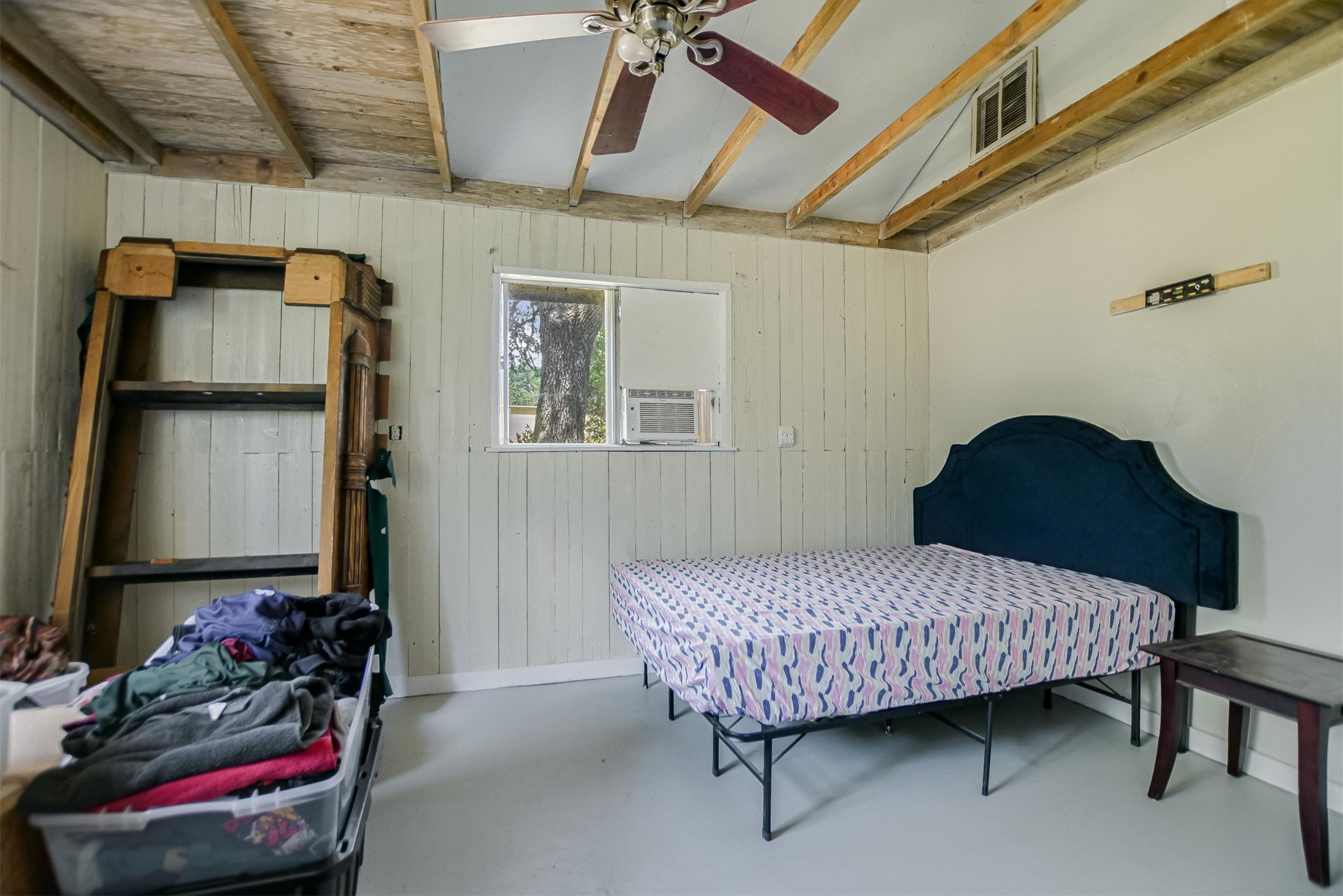 12711 Rr, Unit 12 Wimberley, TX 78676 - Photo 16 of 20 The private bedroom in the cottage offers a quiet retreat with easy access to the full bathroom