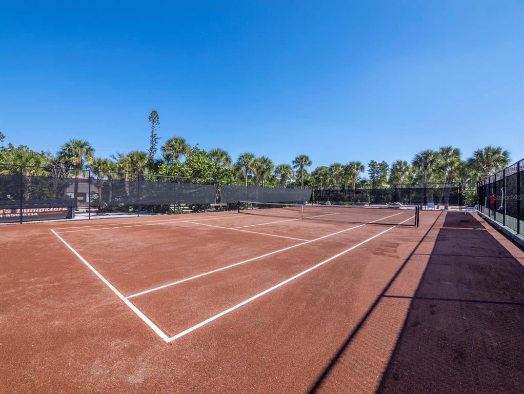 7233 Pine Needle Road Sarasota, FL 34242 - Photo 29 of 49 a view of a tennis court