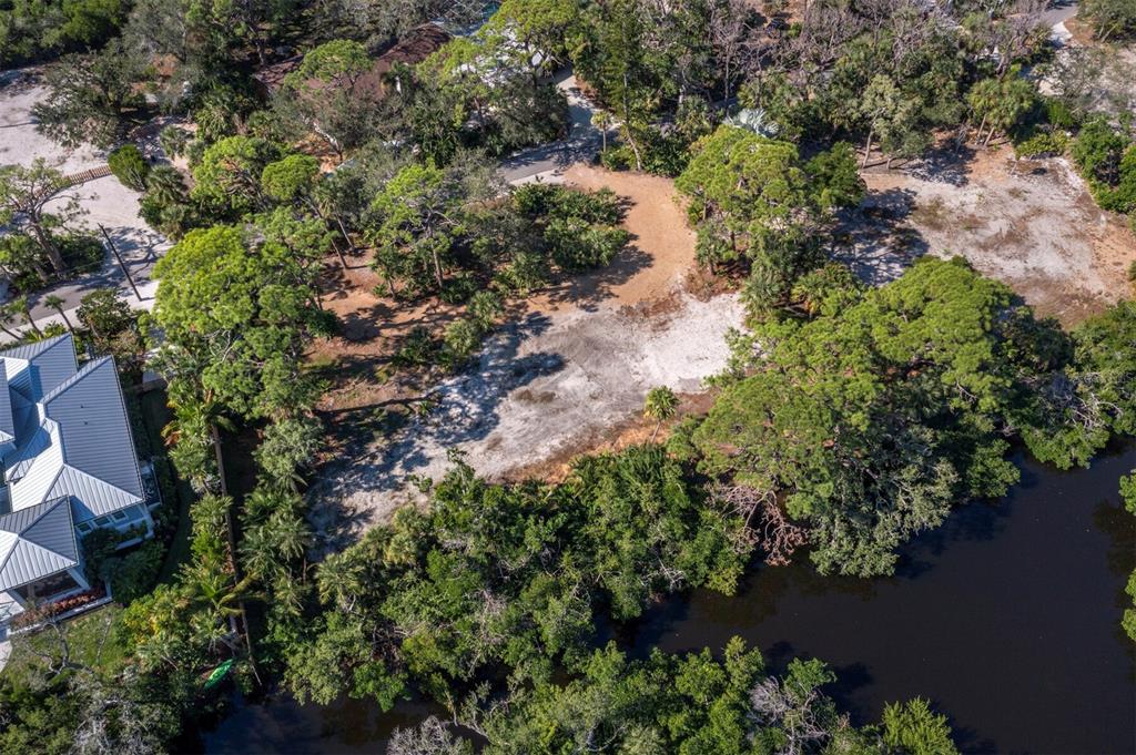7233 Pine Needle Road Sarasota, FL 34242 - Photo 6 of 49 an aerial view of a houses with yard