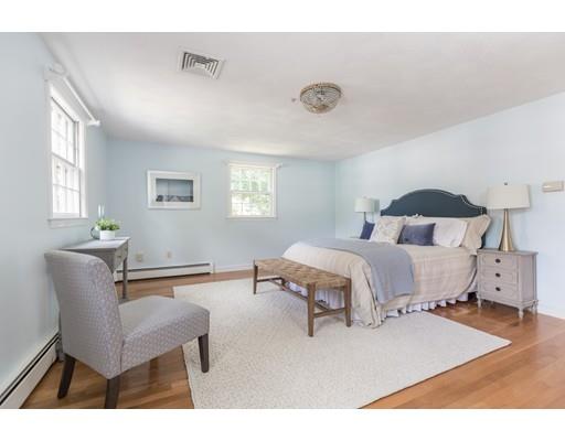 25 Twitchell Street Wellesley, MA 02482 - Photo 12 of 23 a bedroom with a bed and wooden floor