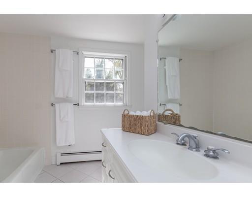 25 Twitchell Street Wellesley, MA 02482 - Photo 16 of 23 a bathroom with a tub sink and mirror