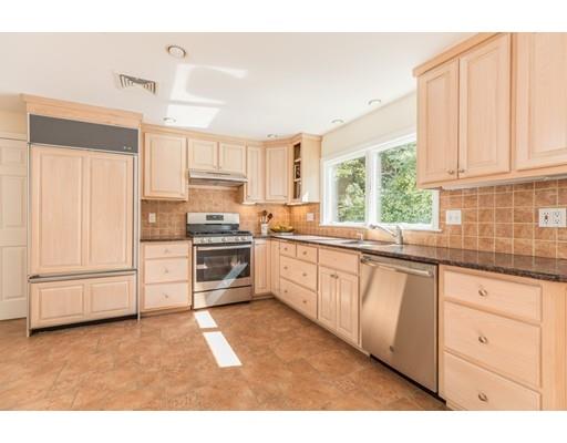 25 Twitchell Street Wellesley, MA 02482 - Photo 5 of 23 a kitchen with granite countertop white cabinets and stainless steel appliances