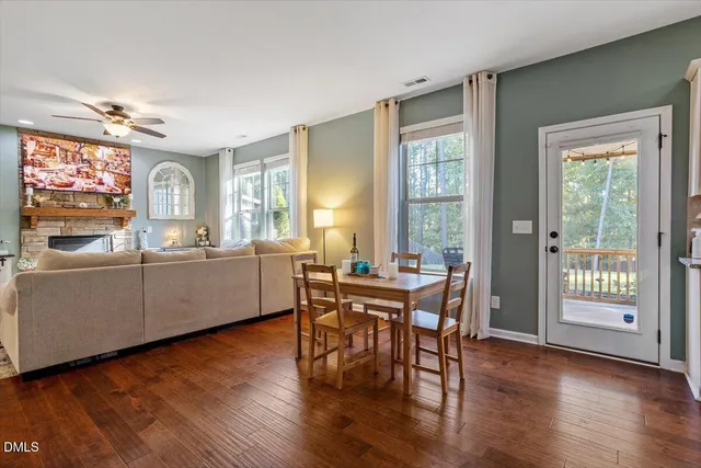 a view of a dining room with furniture and wooden floor