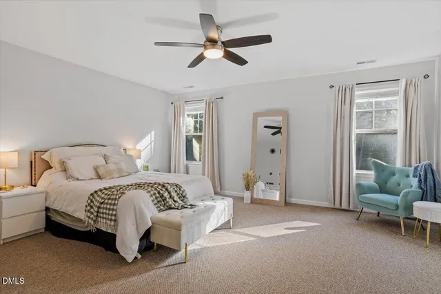 a bedroom with a bed and a couch