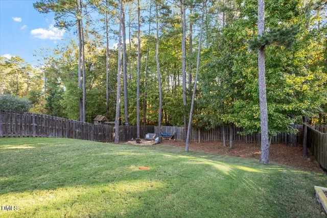 a view of outdoor space with a garden and trees