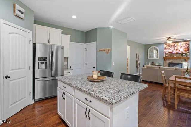 a kitchen with sink refrigerator and microwave