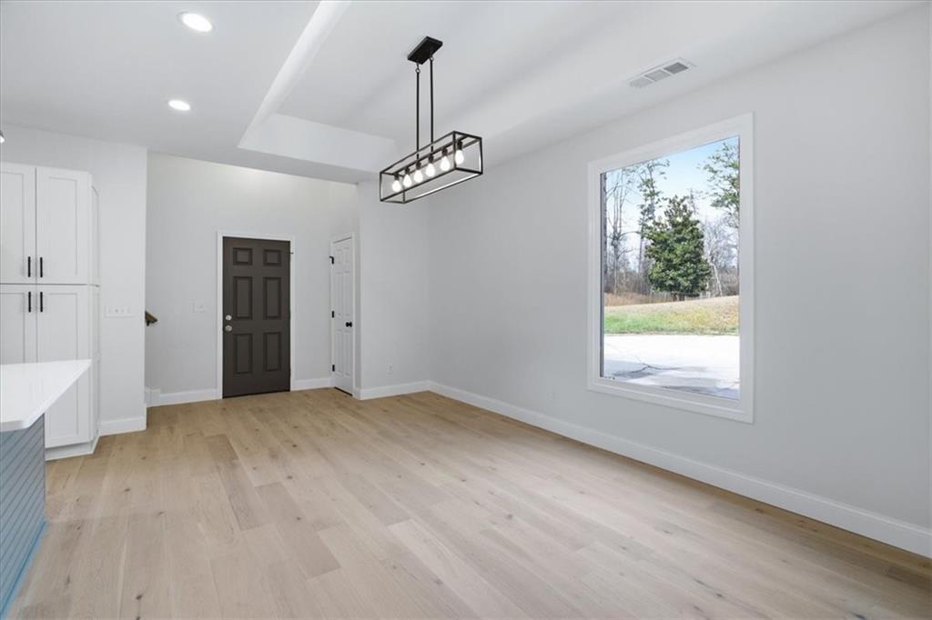 4911 Lower Jersey Road Oxford, GA 30054 - Photo 10 of 56 a view of empty room with window and wooden floor