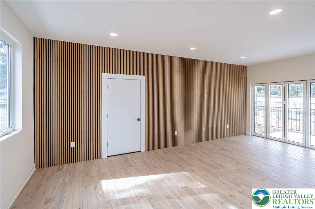 300 Witmer Road Horsham, PA 19044 - Photo 12 of 50 a view of an empty room with wooden floor and a window