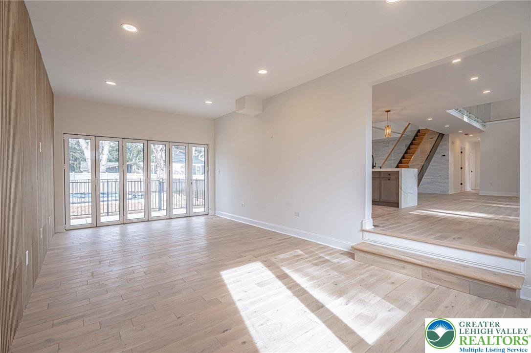 300 Witmer Road Horsham, PA 19044 - Photo 13 of 50 a view of an empty room with wooden floor and a window