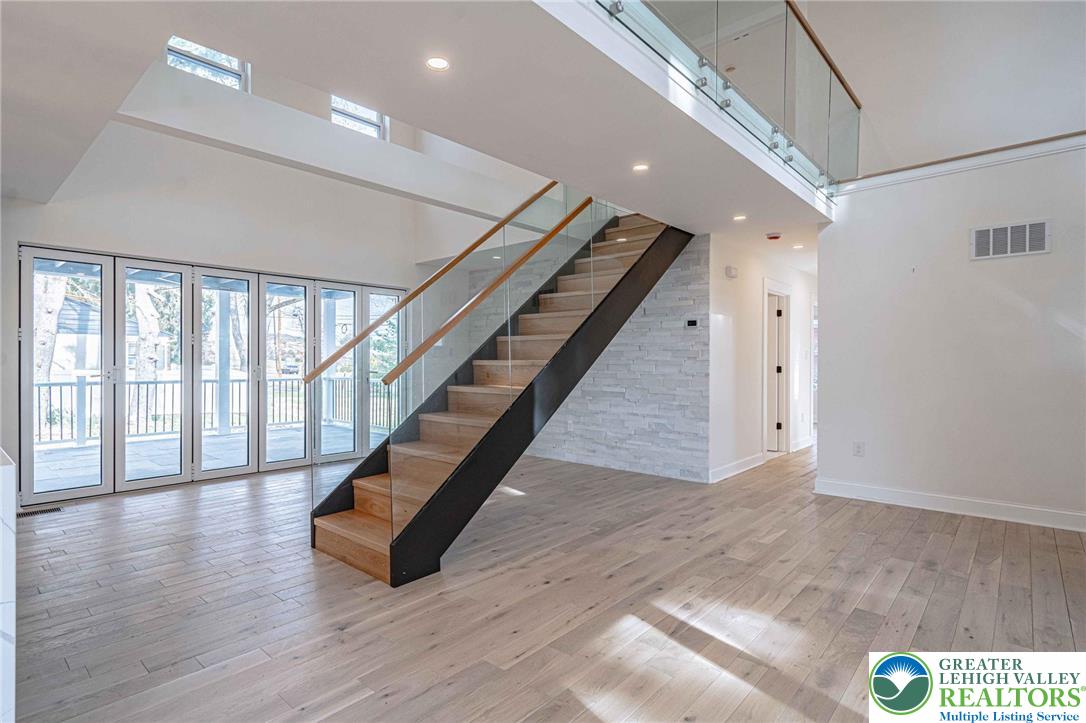 300 Witmer Road Horsham, PA 19044 - Photo 15 of 50 a hallway with stairs and wooden floor