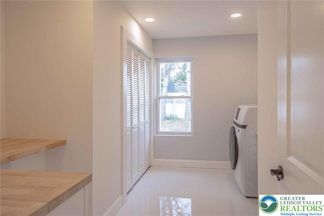 300 Witmer Road Horsham, PA 19044 - Photo 16 of 50 a view of hallway with a window and a kitchen