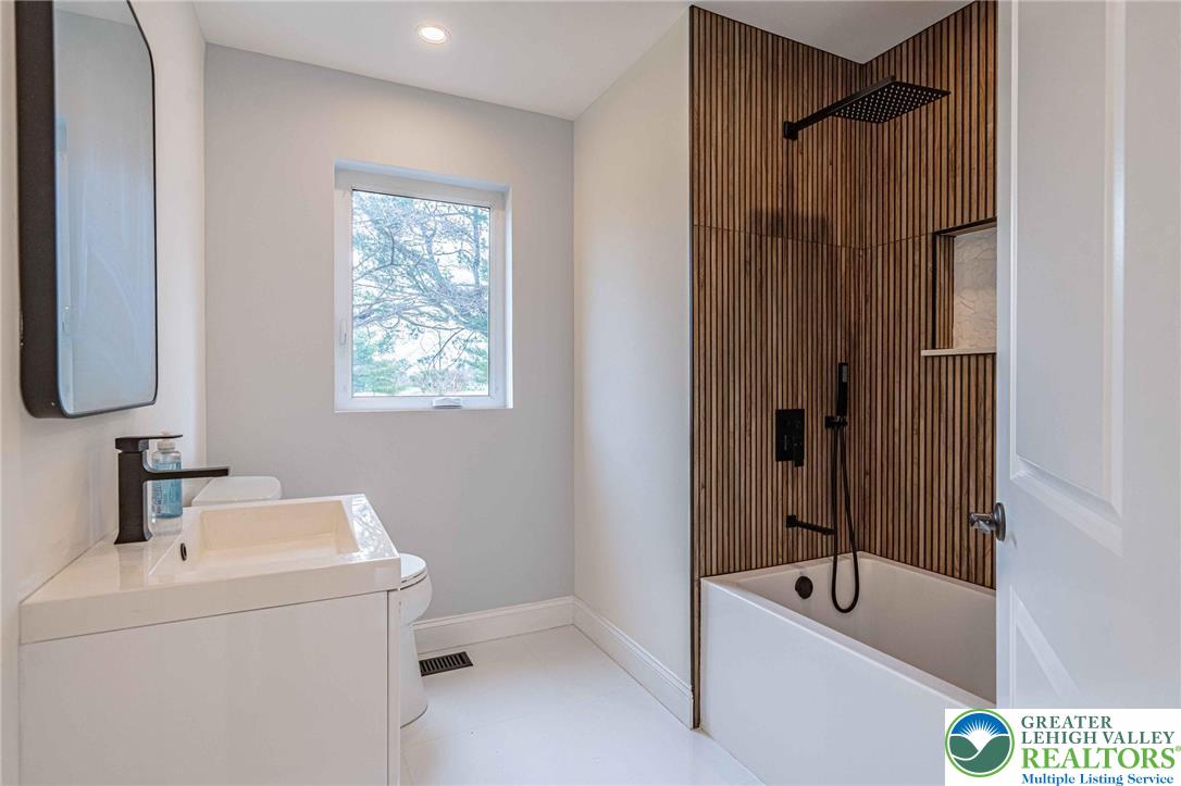300 Witmer Road Horsham, PA 19044 - Photo 18 of 50 a bathroom with a sink a toilet and shower