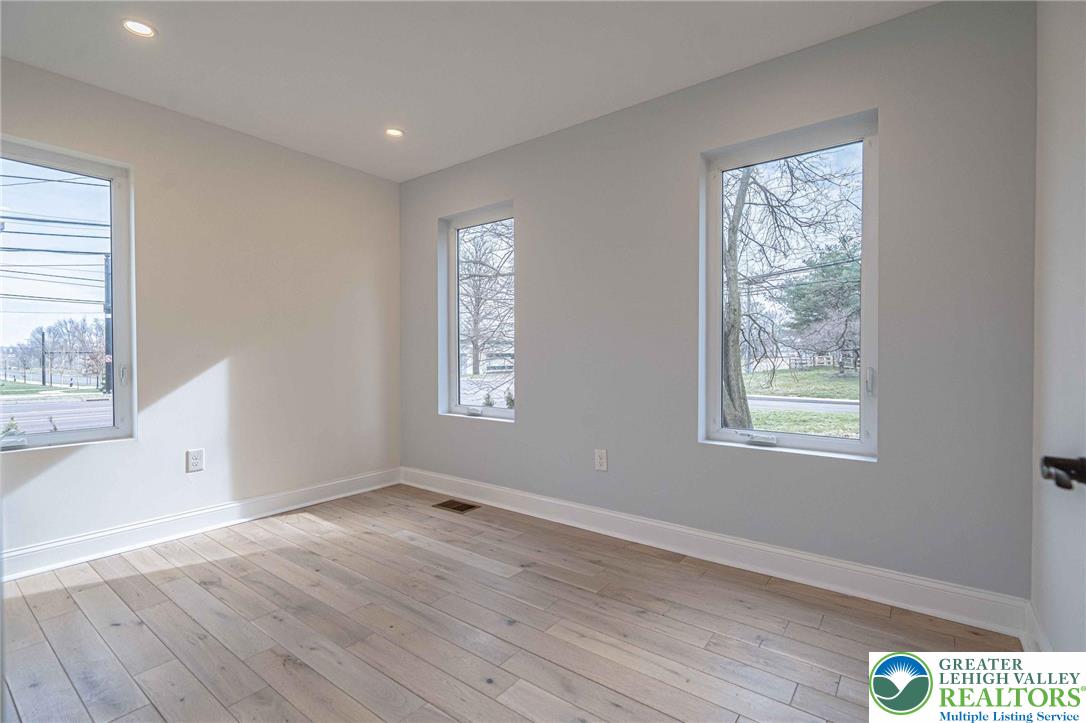 300 Witmer Road Horsham, PA 19044 - Photo 20 of 50 an empty room with wooden floor and windows