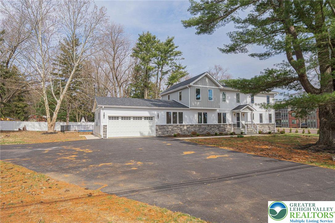 300 Witmer Road Horsham, PA 19044 - Photo 2 of 50 a front view of a house with a yard and garage
