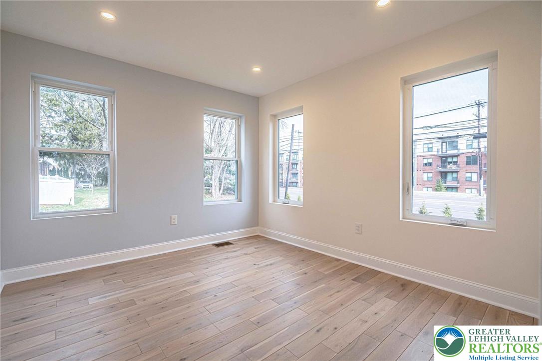 300 Witmer Road Horsham, PA 19044 - Photo 22 of 50 a view of an empty room with wooden floor and a window