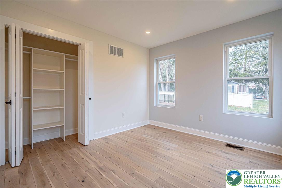300 Witmer Road Horsham, PA 19044 - Photo 23 of 50 a view of an empty room with wooden floor and a window