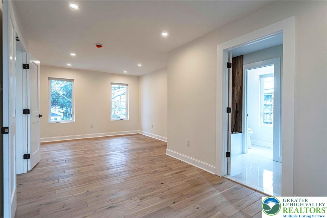 300 Witmer Road Horsham, PA 19044 - Photo 28 of 50 an empty room with wooden floor and windows