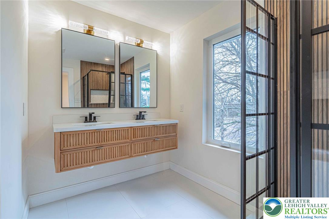300 Witmer Road Horsham, PA 19044 - Photo 33 of 50 a bathroom with a double vanity sink mirror and next to a window