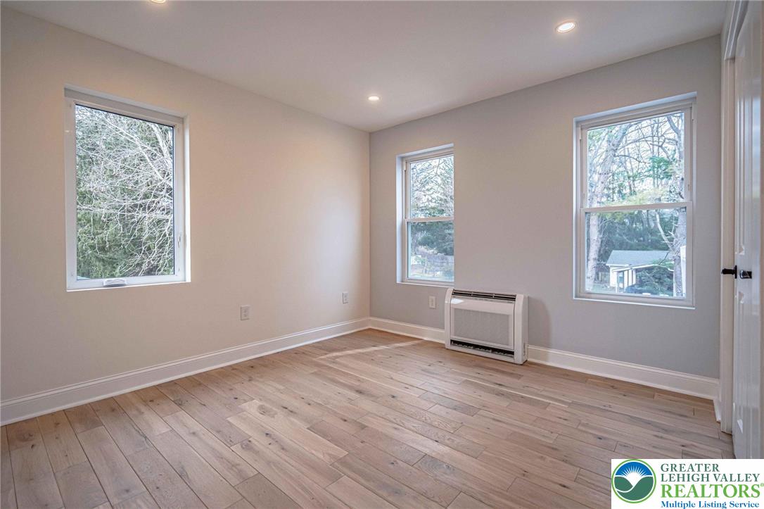 300 Witmer Road Horsham, PA 19044 - Photo 36 of 50 a view of an empty room with wooden floor and a window