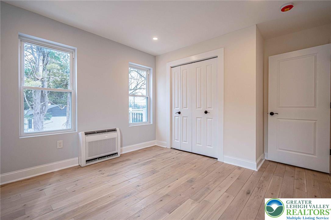 300 Witmer Road Horsham, PA 19044 - Photo 37 of 50 a view of an empty room with wooden floor and a window
