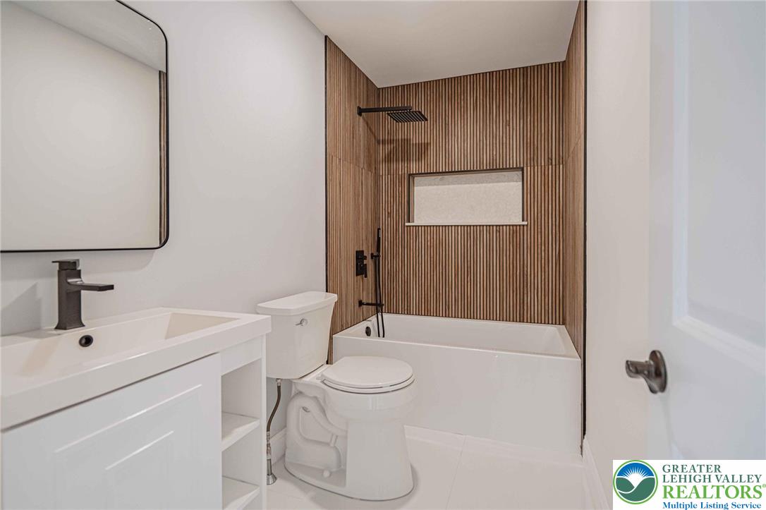 300 Witmer Road Horsham, PA 19044 - Photo 38 of 50 a bathroom with a sink a toilet and shower