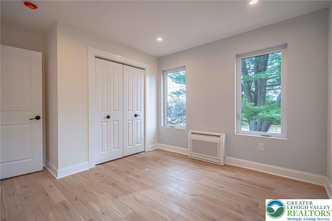 300 Witmer Road Horsham, PA 19044 - Photo 40 of 50 an empty room with wooden floor and windows