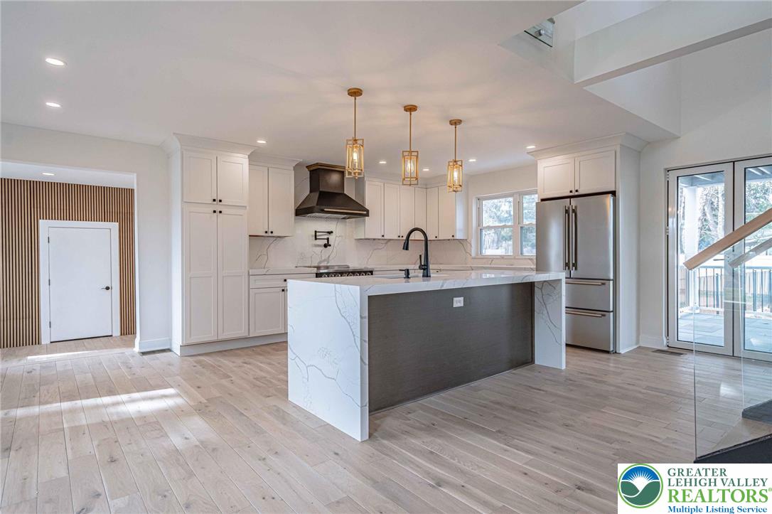 300 Witmer Road Horsham, PA 19044 - Photo 6 of 50 a kitchen with stainless steel appliances kitchen island a refrigerator sink and cabinets
