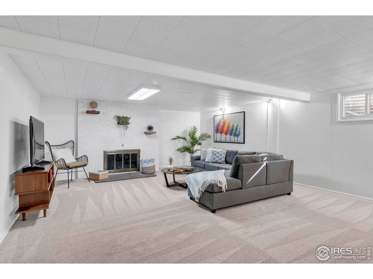 3205 19th Street Boulder, CO 80304 - Photo 12 of 40 Large Rec Room with Cozy Fireplace