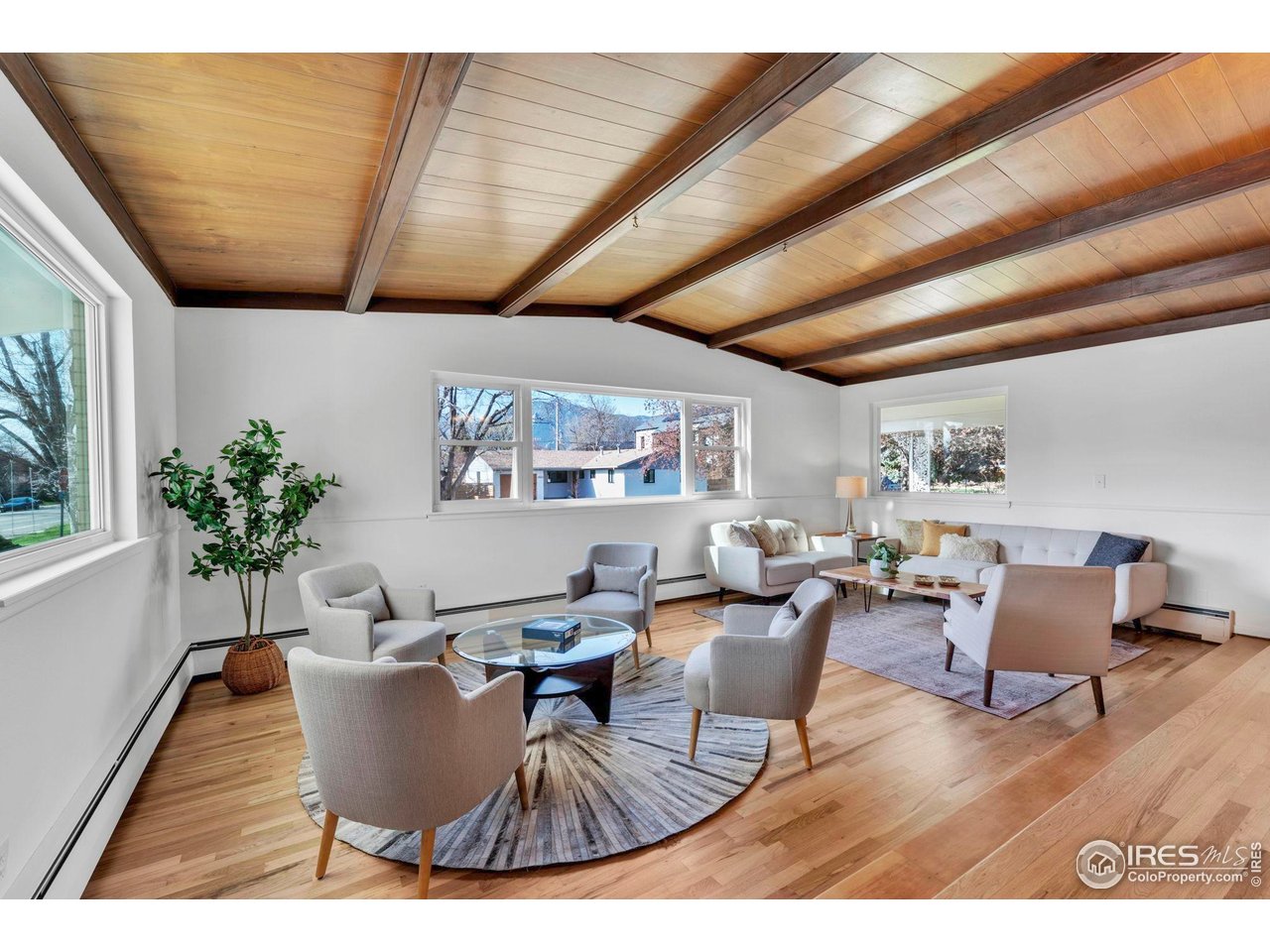 3205 19th Street Boulder, CO 80304 - Photo 2 of 40 Stunning vaulted shiplap ceiling and Sunken Living room add warmth & character