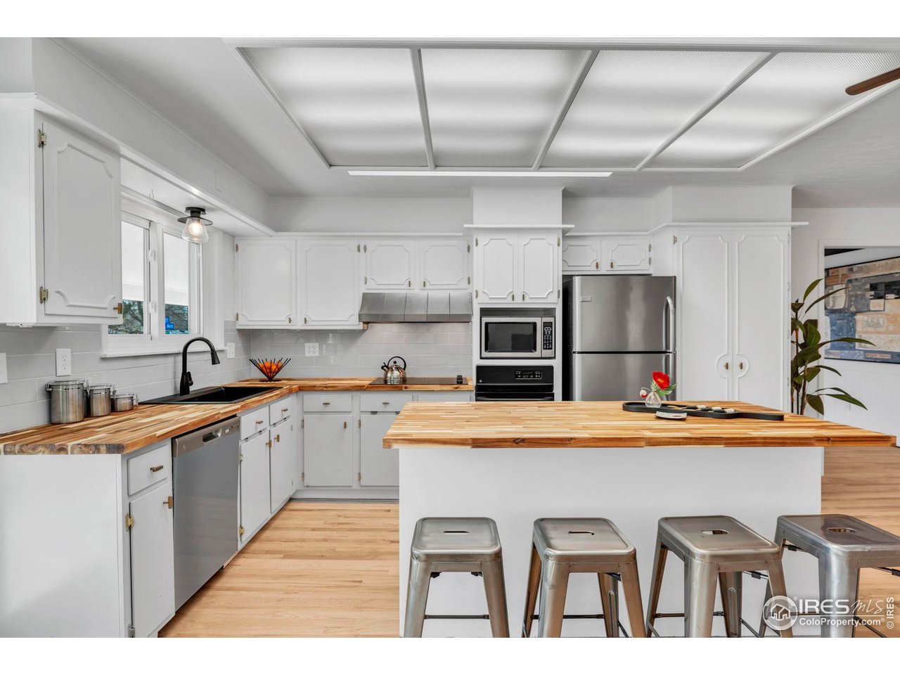 3205 19th Street Boulder, CO 80304 - Photo 21 of 40 Butchers block counters and bar seating