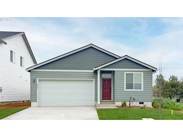 a view of a yard in front view of a house
