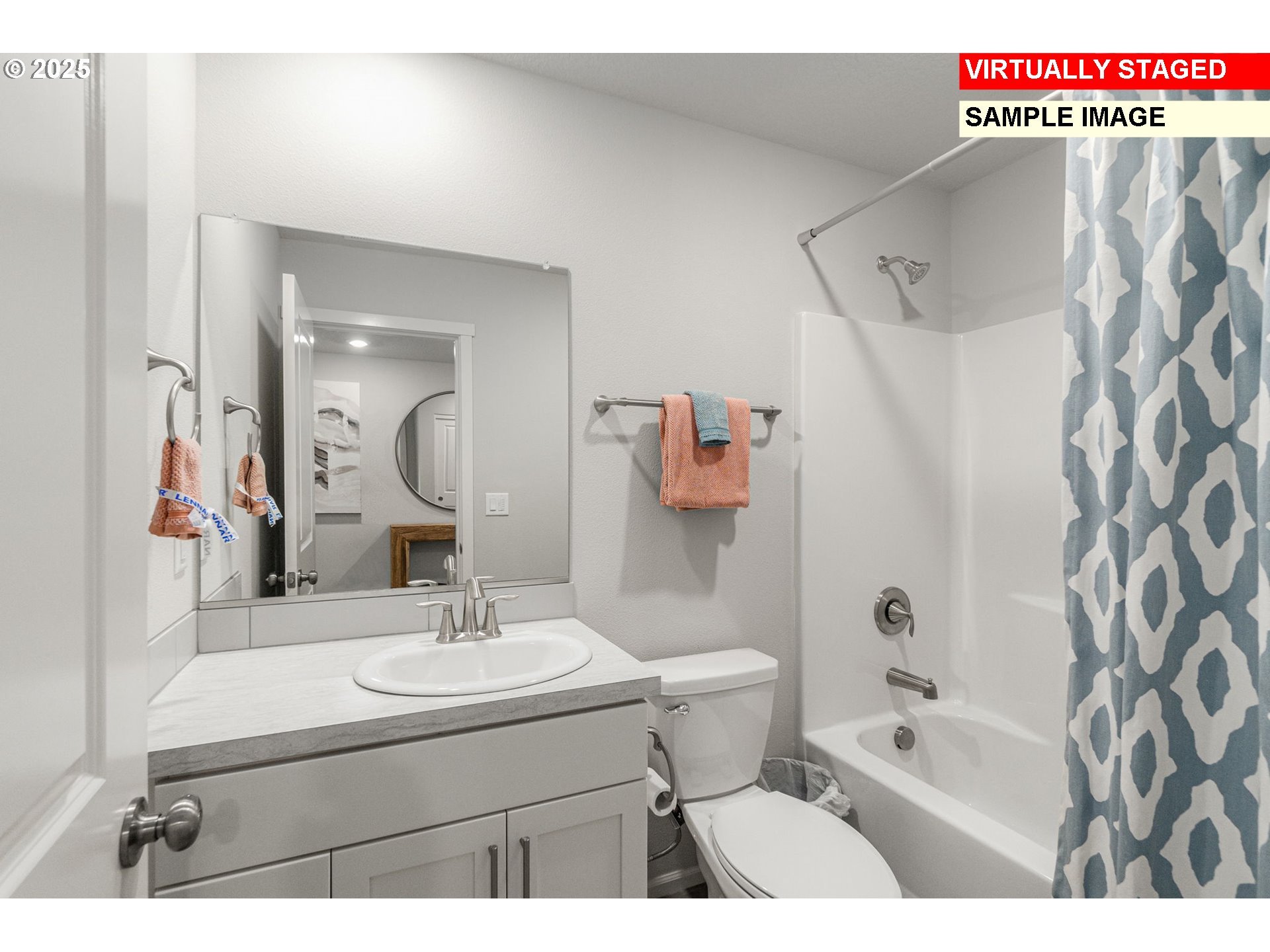 1074 Clemson Street Gervais, OR 97026 - Photo 17 of 18 a bathroom with a sink a mirror a bathtub and shower
