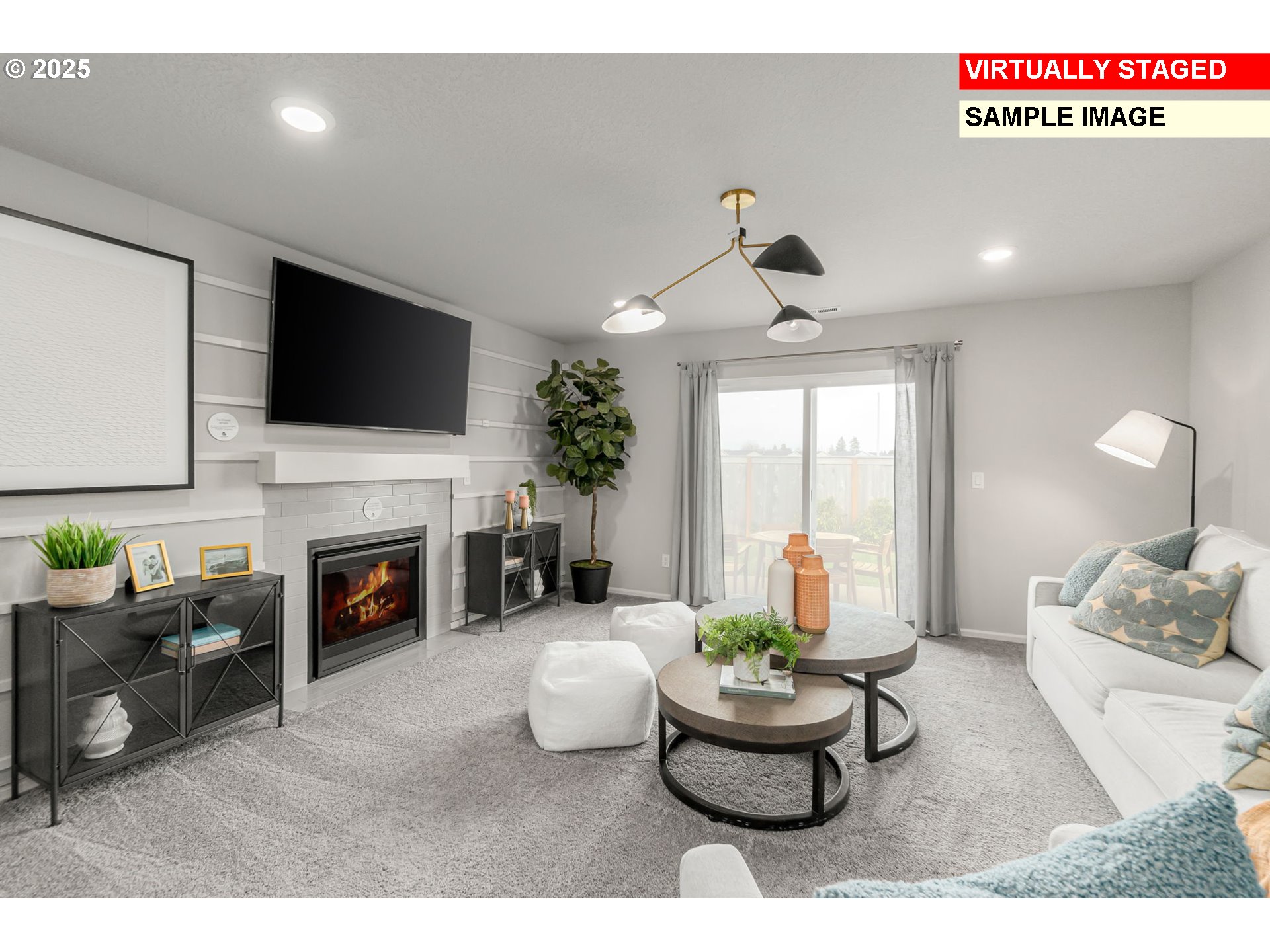 1074 Clemson Street Gervais, OR 97026 - Photo 4 of 18 a living room with furniture a fireplace and a flat screen tv