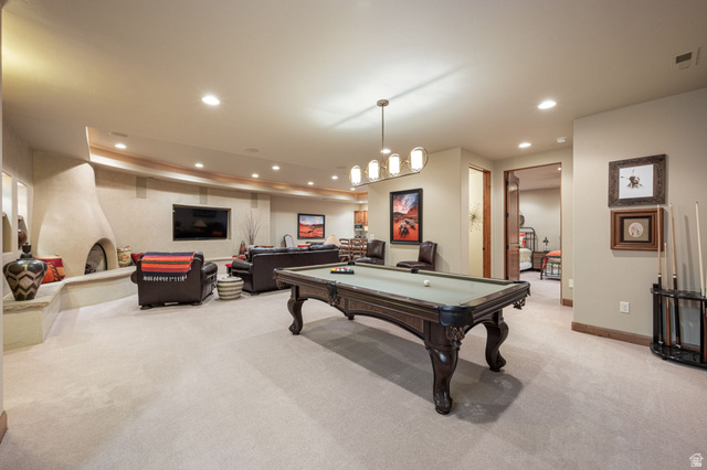 2331 West Entrada Trail, Unit 61 St. George, UT 84770 - Photo 35 of 69 Spacious recreation room featuring a built-in fireplace, recessed lighting, and a decorative light fixture