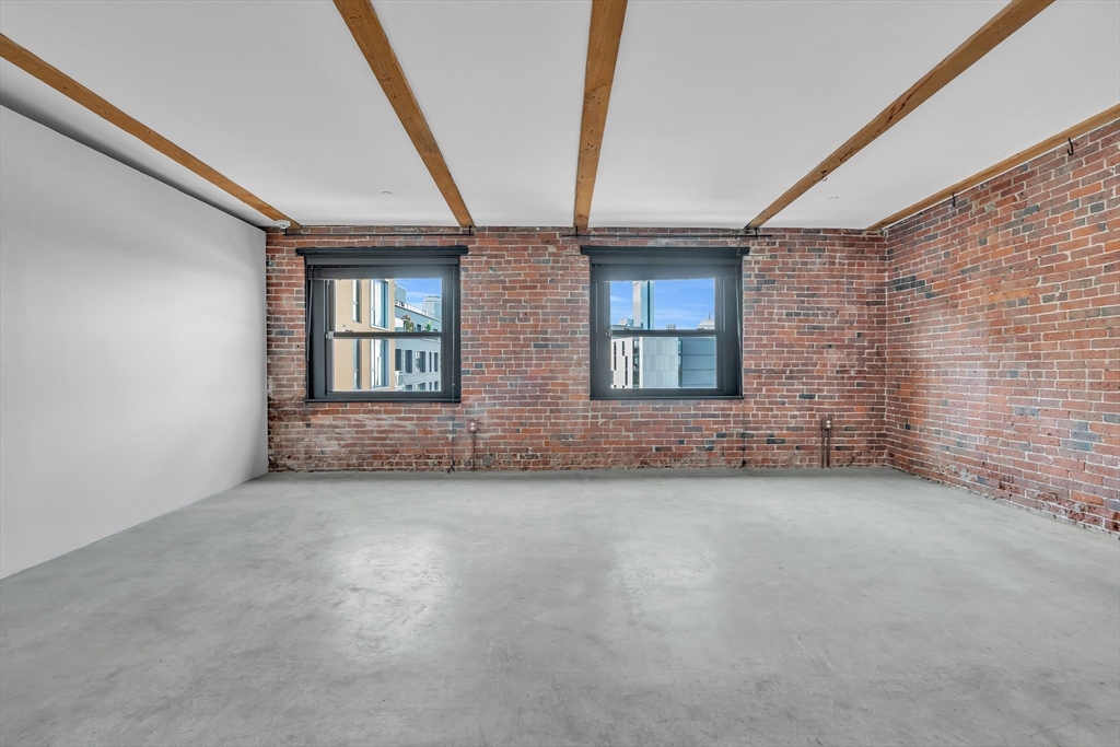 90 Wareham Street, Unit 505 Boston, MA 02118 - Photo 2 of 11 an empty room with windows
