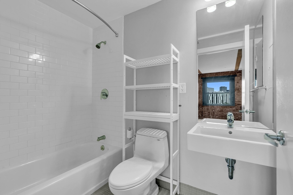 90 Wareham Street, Unit 505 Boston, MA 02118 - Photo 10 of 11 a bathroom with a sink toilet and shower
