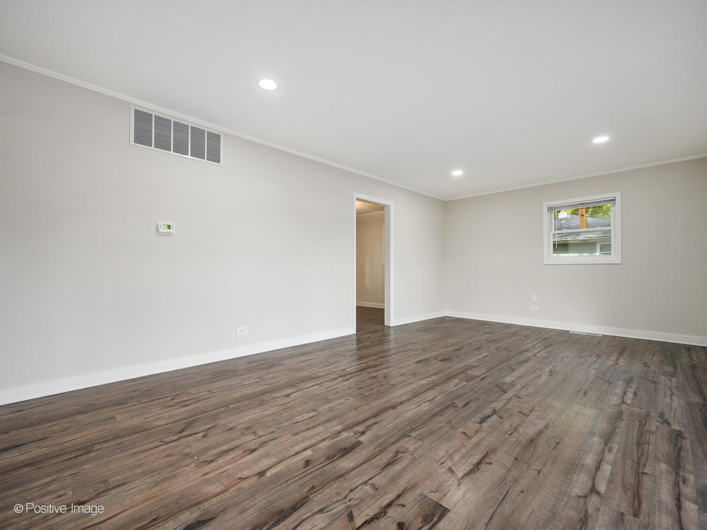 353 Blackhawk Drive Park Forest, IL 60466 - Photo 5 of 15 a view of an empty room with wooden floor