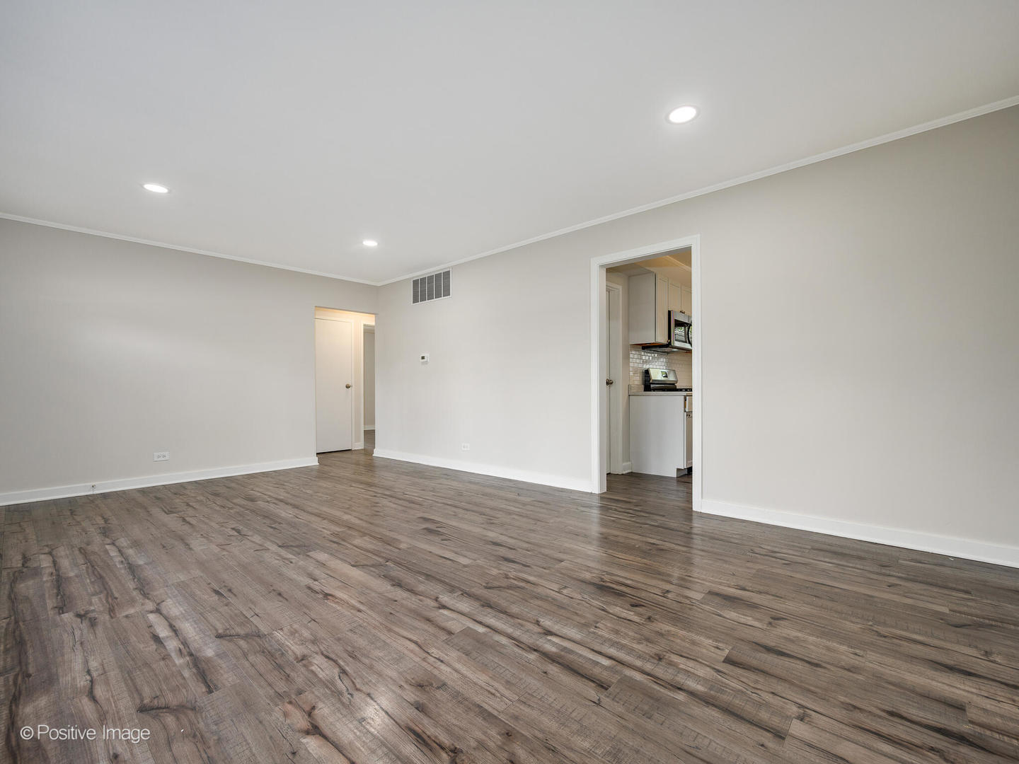 353 Blackhawk Drive Park Forest, IL 60466 - Photo 6 of 15 a view of an empty room with wooden floor and a window