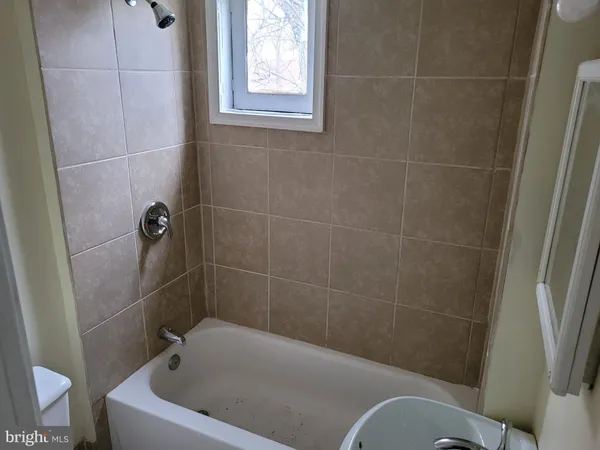 a bath tub sitting in a bathroom