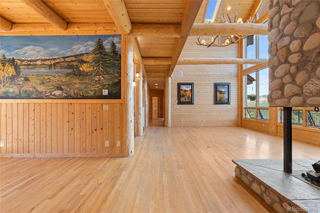a view of a room with wooden floor
