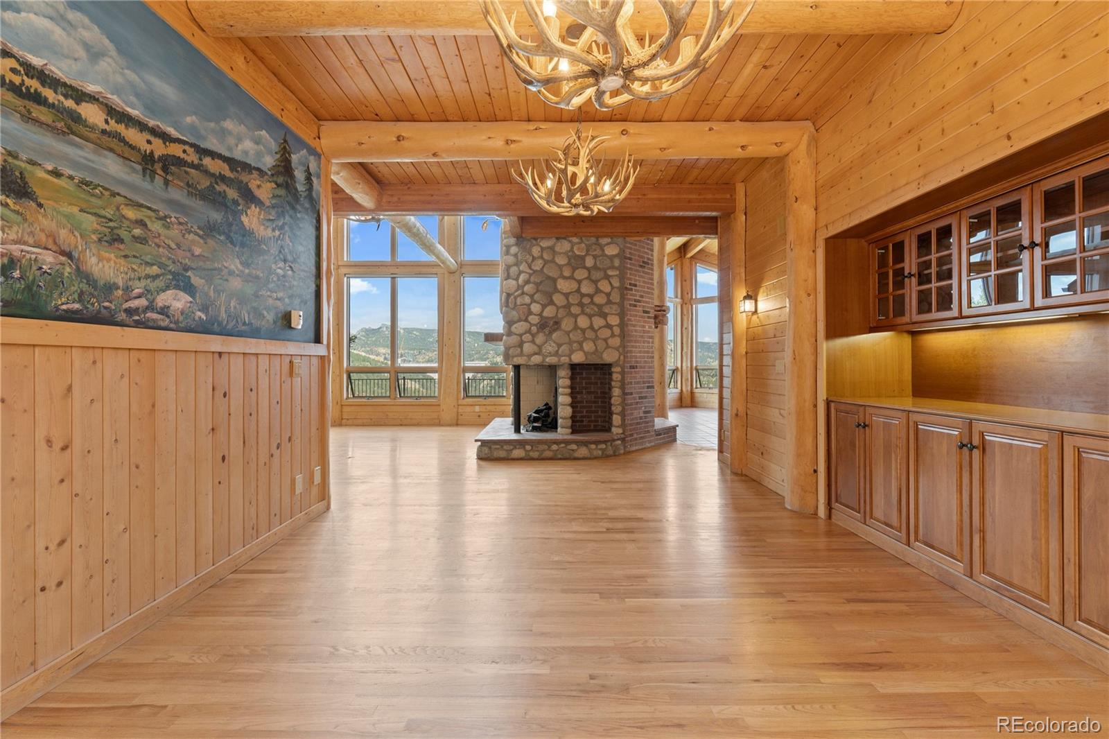 2489 Gross Dam Road Golden, CO 80403 - Photo 13 of 47 a view of a entryway of a building with wooden floor