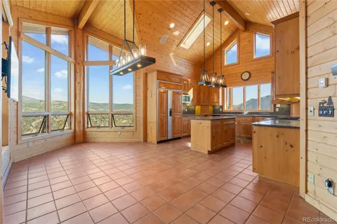 a view of a kitchen with furniture and a kitchen