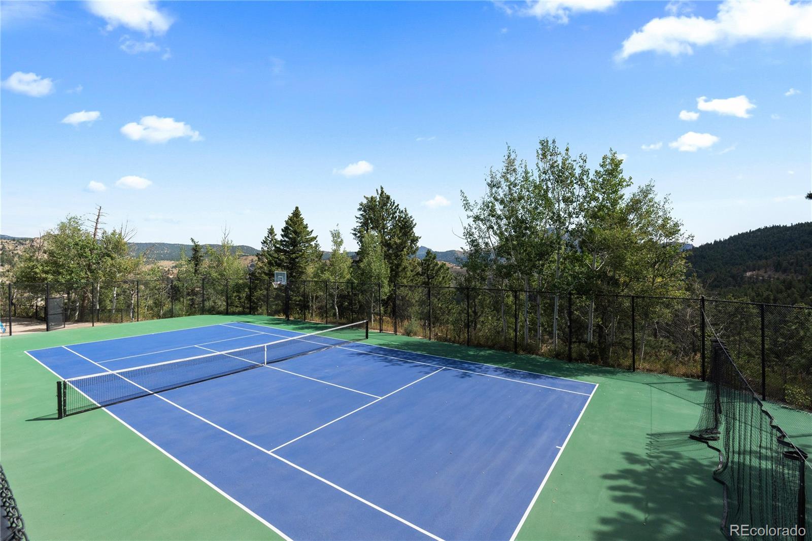 2489 Gross Dam Road Golden, CO 80403 - Photo 2 of 47 a view of an outdoor space and tennis court