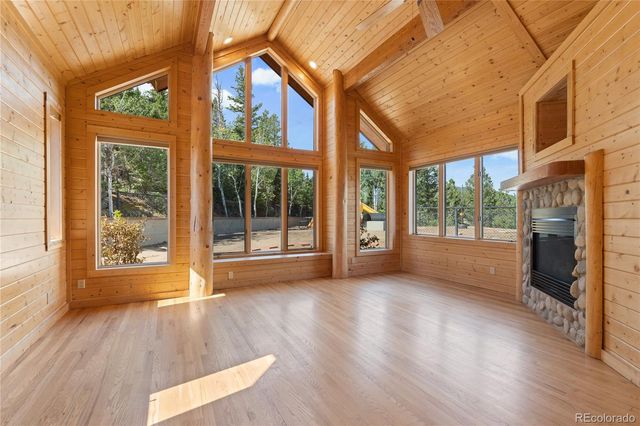 a view of room with window and wooden floor