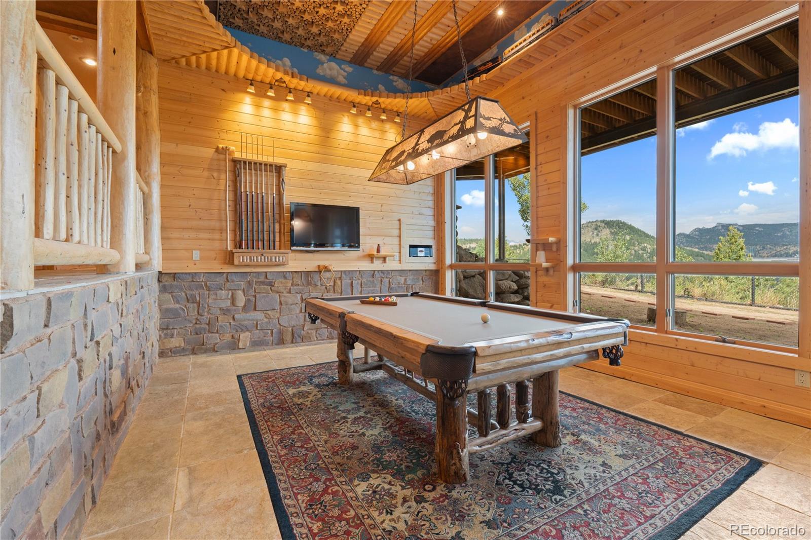 2489 Gross Dam Road Golden, CO 80403 - Photo 29 of 47 a room with pool table and windows