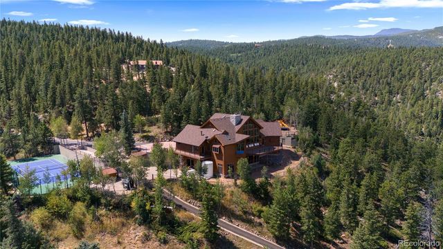 a view of a town with mountains in the background