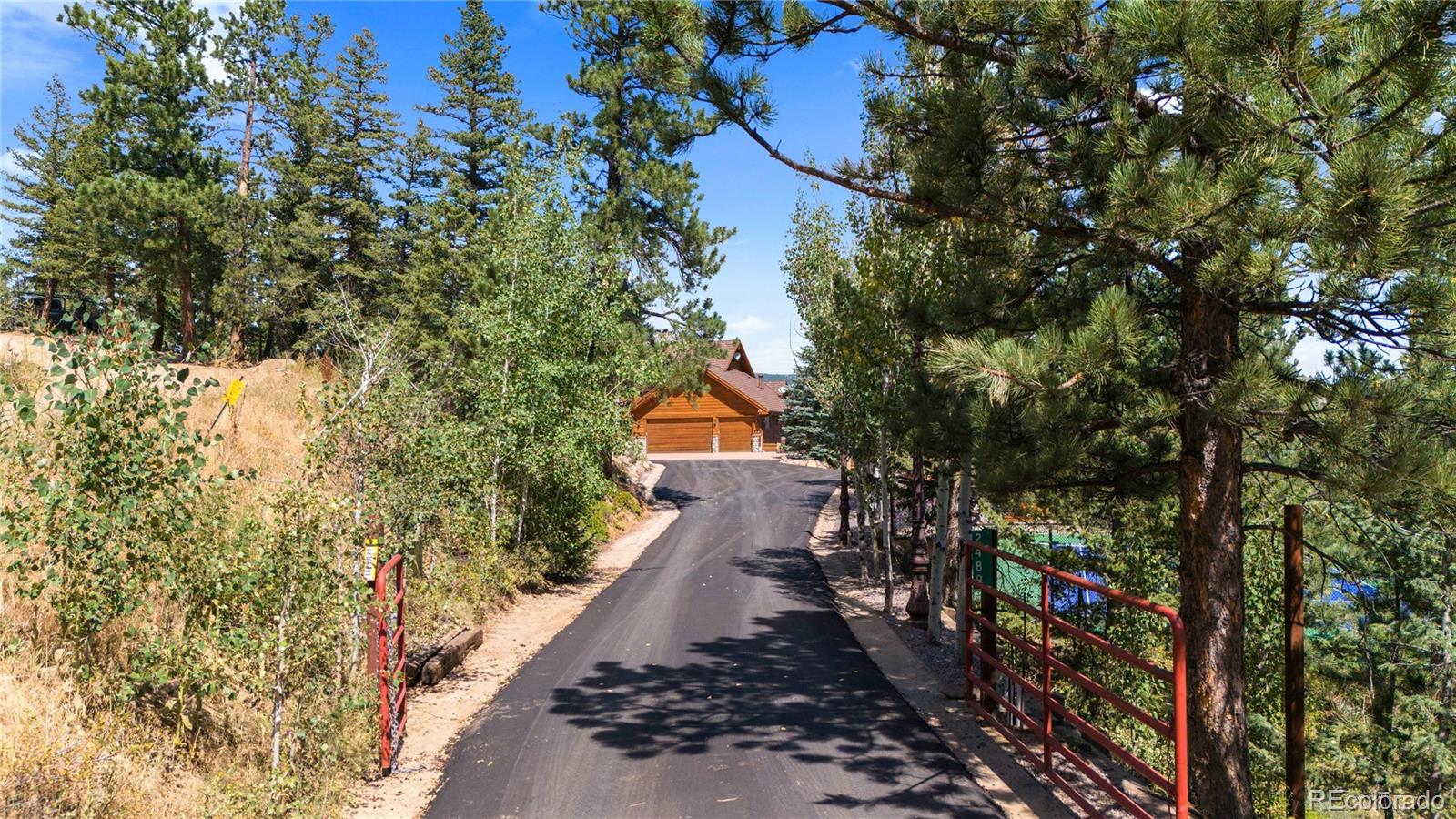 2489 Gross Dam Road Golden, CO 80403 - Photo 7 of 47 a view of a house with a yard