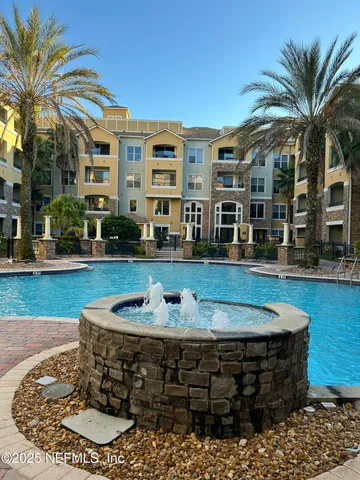 a view of a building with a swimming pool