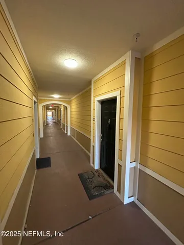 a kitchen with a sink a stove top oven and cabinetry