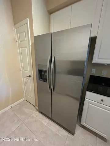 a kitchen with granite countertop a sink and a stove top oven